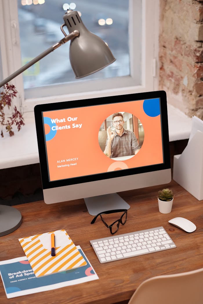 Offerings Stylish home office setup with computer showcasing client testimonials.